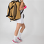 Person wearing a yellow backpack and white shorts on a plain background